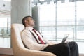 Bored businessman stares out window Royalty Free Stock Photo