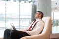 Bored businessman stares out window Royalty Free Stock Photo