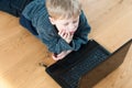 Bored child looking at online websites Royalty Free Stock Photo