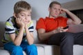 Bored child sitting on the sofa Royalty Free Stock Photo