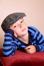Bored Child Wearing Flat Cap Royalty Free Stock Photo