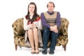 Bored couple on couch Royalty Free Stock Photo