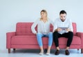 Bored and disregard couple lover sitting on couch at home together,Family issues Royalty Free Stock Photo