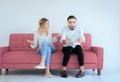 Bored and disregard couple lover sitting on sofa in living room at house together,Family issues Royalty Free Stock Photo