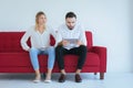 Bored and disregard couple lover sitting on couch in living room together,Family issues Royalty Free Stock Photo