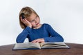 Bored girl with book on white background Royalty Free Stock Photo