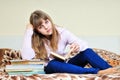 Bored girl with books