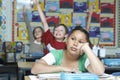 Bored Girl With Classmates Raising Hands In Background