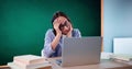 Bored Girl In Classroom Using Computer Technology Royalty Free Stock Photo