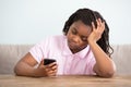 Bored Girl Looking At Cell Phone Royalty Free Stock Photo