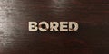 Bored - grungy wooden headline on Maple - 3D rendered royalty free stock image