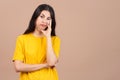 Bored hispanic woman standing and looking at the camera