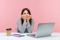 Bored inefficient woman office employee sitting at workplace leaning head on hands, lonely disappointed female tired of wimp work Royalty Free Stock Photo