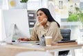 A bored, lazy and tired employee working on a computer in the office leaning on her desk. An overworked business woman Royalty Free Stock Photo