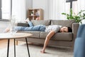 Bored or lazy young woman lying on sofa at home Royalty Free Stock Photo