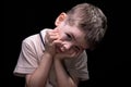Bored little boy with hands on face Royalty Free Stock Photo