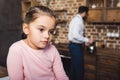 bored little child looking away while father cooking breakfast blurred Royalty Free Stock Photo