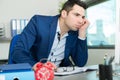 Bored male executive at office desk Royalty Free Stock Photo