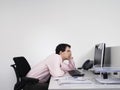 Bored Male Office Worker At Desk Royalty Free Stock Photo