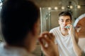 Bored man brushing teeth,sad,tired.Occupational burnout syndrome.Chronic stress.Depressed single man.Lazy with personal hygiene