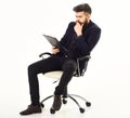 Bored man in formal suit sitting on office chair Royalty Free Stock Photo