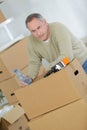 Bored man preparing to move out Royalty Free Stock Photo