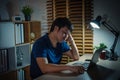 bored man working with laptop at night Royalty Free Stock Photo