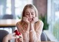 Bored millennial lady not willing to accept engagement ring, rejecting marriage proposal at cafe Royalty Free Stock Photo