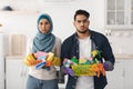 Bored muslim family cleaning their new apartment Royalty Free Stock Photo