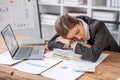Bored at office work funny sleepy woman worker resting on hand sleeping at workplace, unmotivated lazy woman feeling Royalty Free Stock Photo