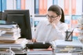 Bored office worker sitting at desk Royalty Free Stock Photo