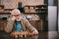 Bored senior man playing Royalty Free Stock Photo