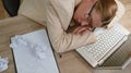 Bored tired sleepy business woman falling asleep after routine work on laptop computer, office desk Royalty Free Stock Photo