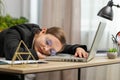 Bored sleepy business woman worker working on laptop computer, yawning falling asleep at home office Royalty Free Stock Photo