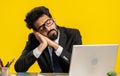 Bored sleepy business man worker working on laptop computer, yawning, falling asleep at home office Royalty Free Stock Photo