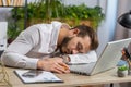 Bored sleepy business man worker working on laptop computer, yawning, falling asleep at home office Royalty Free Stock Photo