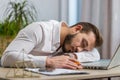 Bored sleepy business man worker working on laptop computer, yawning, falling asleep at home office Royalty Free Stock Photo