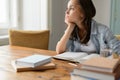 Bored student girl sitting home looking away Royalty Free Stock Photo