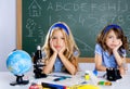 Bored student kids at school classroom in desk Royalty Free Stock Photo