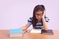 Bored and tired asian student girl doing homework Royalty Free Stock Photo