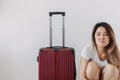 Bored and tired face woman in her private loungewear and baggage isolated on white. Royalty Free Stock Photo