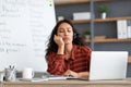 Bored and tired teacher sleeping sitting at desk Royalty Free Stock Photo