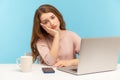 Bored tired unhappy woman employee sitting at workplace with laptop and leaning on hand, feeling lazy