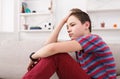 Bored unhappy teenage boy sitting at home Royalty Free Stock Photo