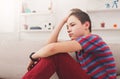 Bored unhappy teenage boy sitting at home Royalty Free Stock Photo