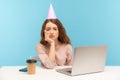 Bored upset woman, office employee with party cone looking with depression frustration, celebrating birthday alone