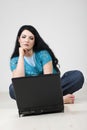 Bored woman browsing on a laptop Royalty Free Stock Photo