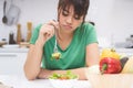 Bored woman eating salad disorder during diet Royalty Free Stock Photo
