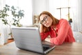Bored woman with laptop working at home office Royalty Free Stock Photo