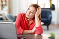 Bored woman with laptop working at home office Royalty Free Stock Photo